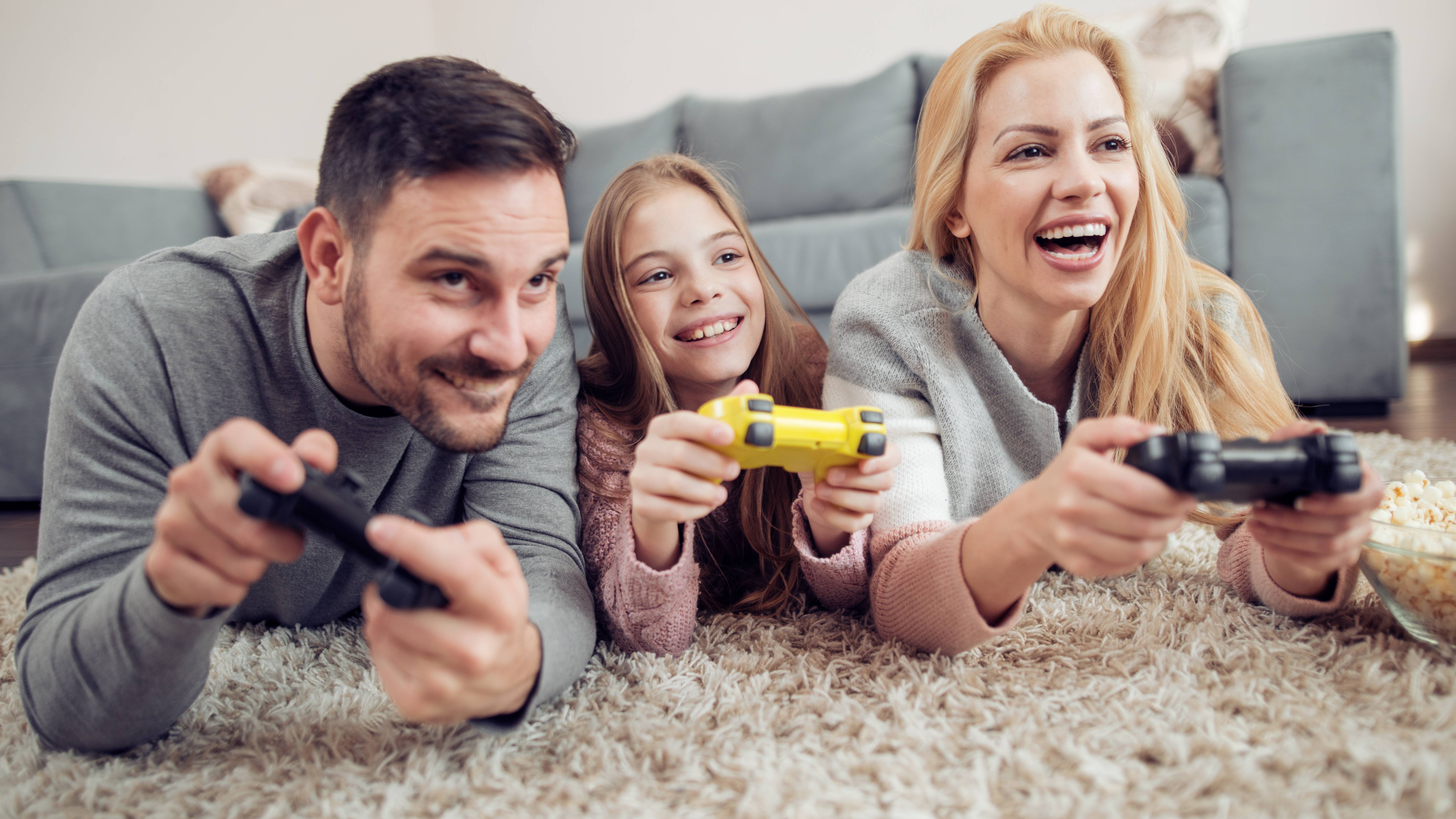 Happy family playing video games with fast internet from Green