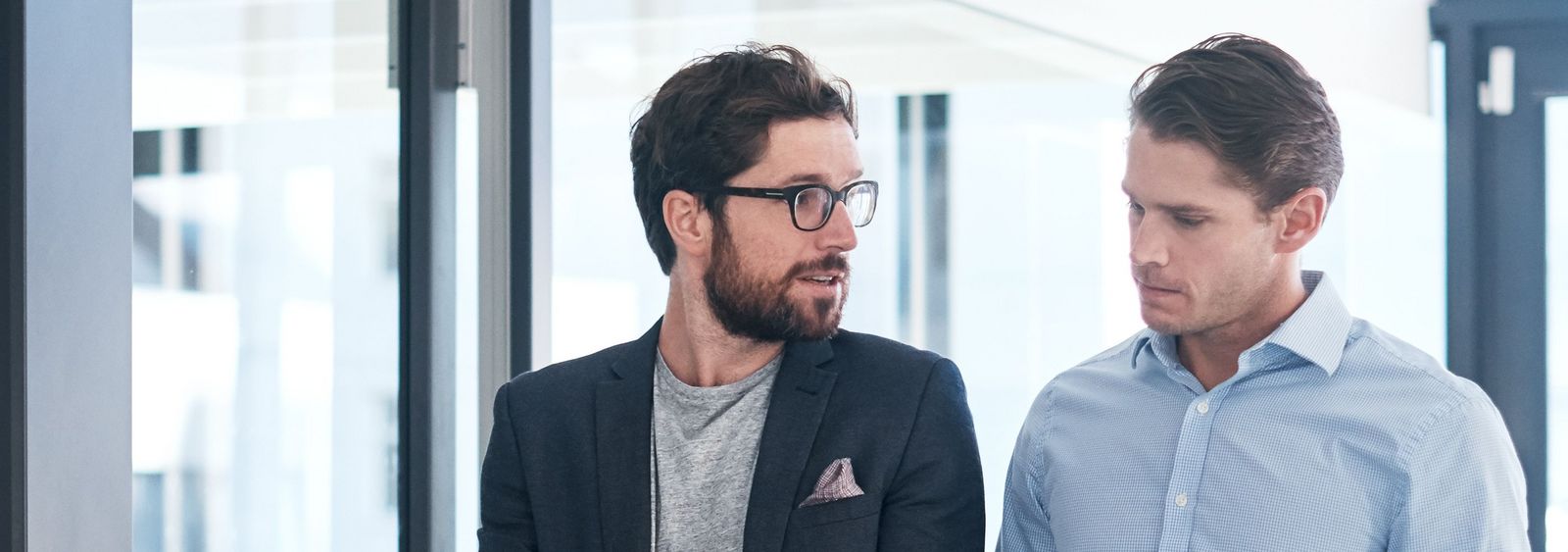 Two men discussing in an office